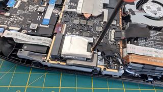 Upgrading Steam Deck SSD: Unscrew SSD.