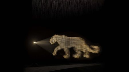 Cartier scented installation OSNI 2 with panther made out of perfume and light 