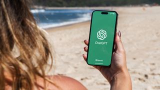 Woman using ChatGPT app on the beach