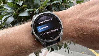 Garmin Fenix 8 Pro on wrist showing LiveTrack feature