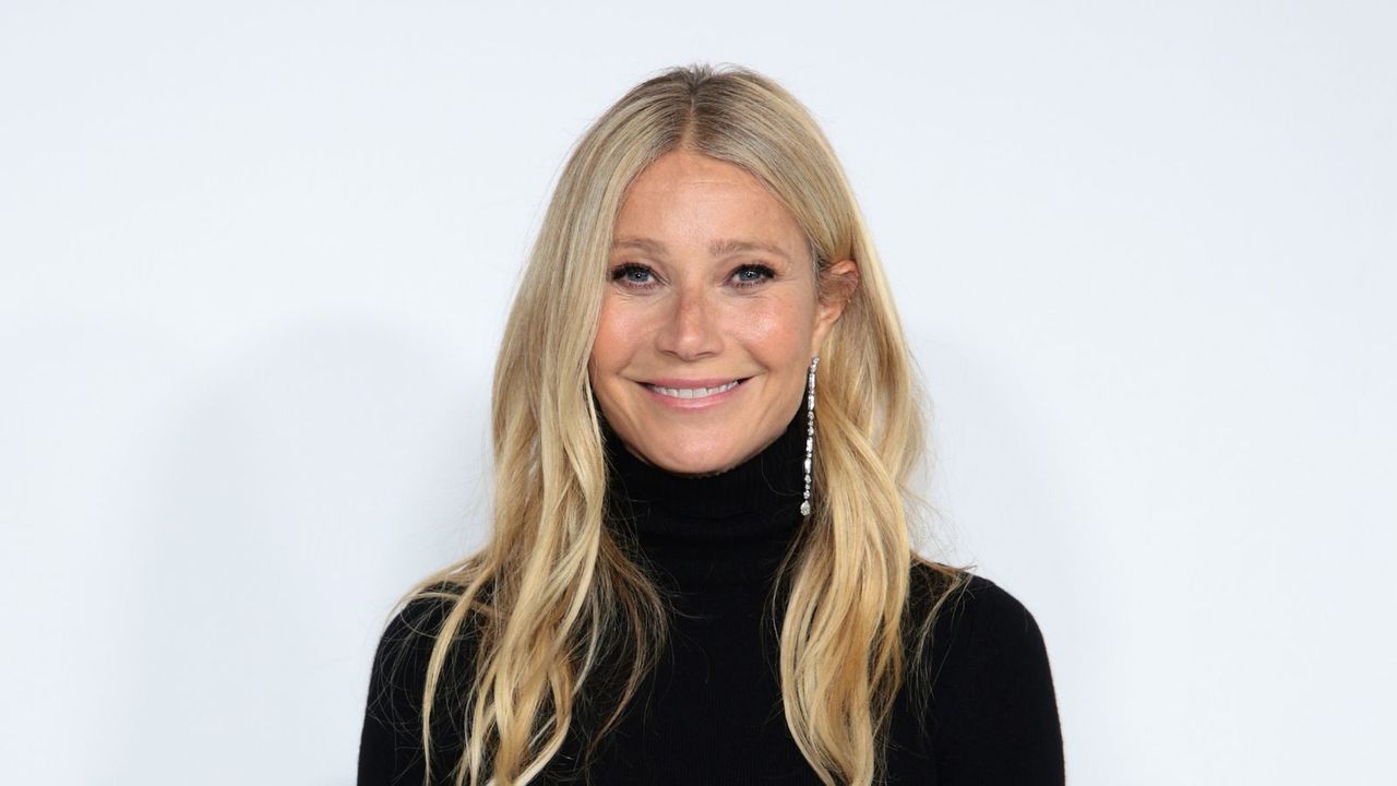 gwyneth paltrow in black turtleneck on white background