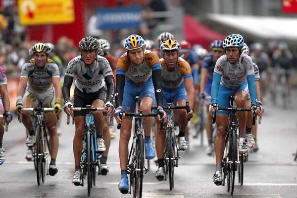 Their faces say it all...rain and a crash-marred stage make for unhappy riders at the finish line.