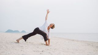 Yoga teacher Lorraine Taylor performs a twisting lunge