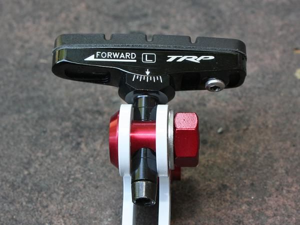 TRP's Inplace Adjust pads allow for easy toe-in adjustments (in a brake design that normally doesn't allow for it) via a clever slotted socket arrangement. The range isn't as great as the markings would suggest but it's enough to get the job done