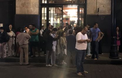 Residents of Mexico City wait outside as buildings sway from earthquake