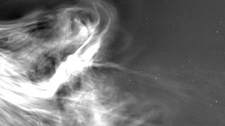 bright wisps of light on a starry background