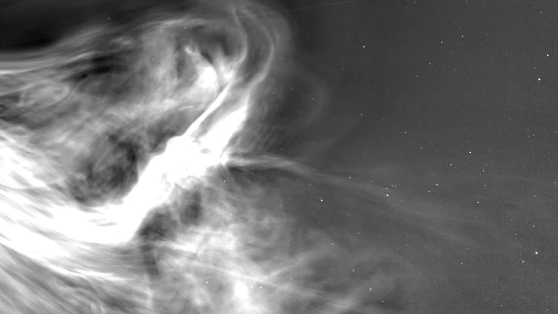 bright wisps of light on a starry background