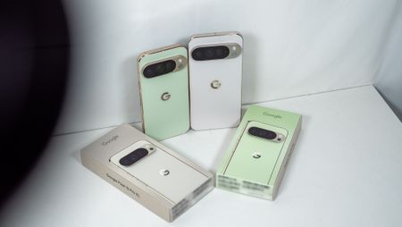 A jade Google Pixel 10 Pro and a white Google Pixel 10 Pro XL with their respective boxes