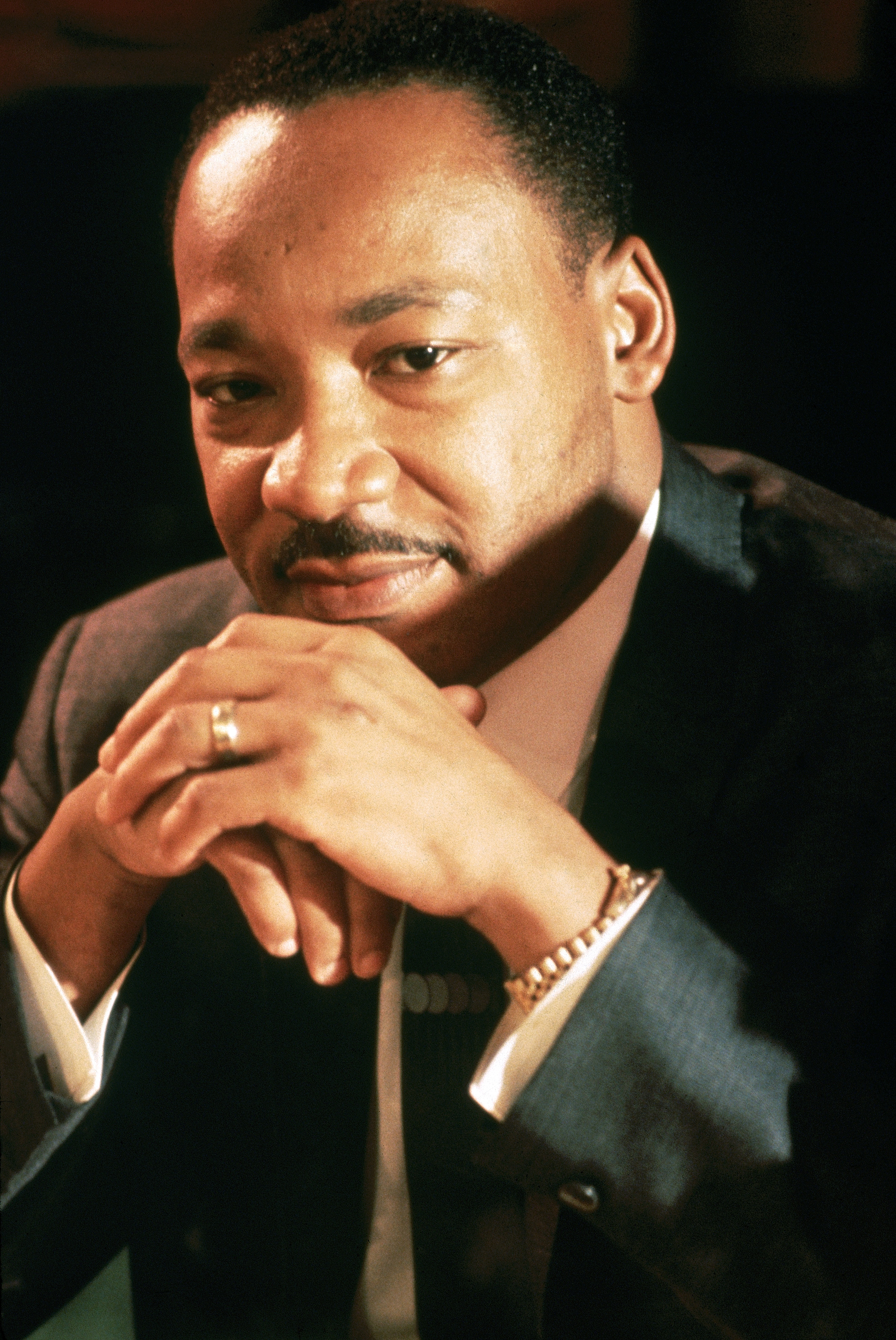 Martin Luther King in a grey-black suit
