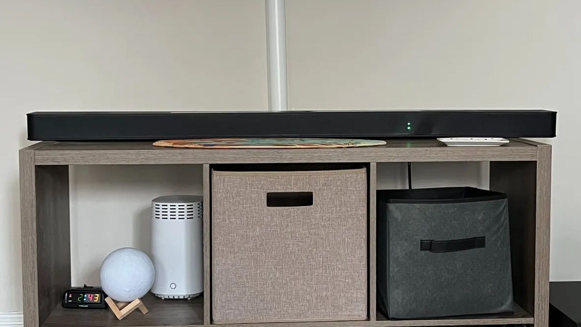 The LG S95TR soundbar on a shelving unit