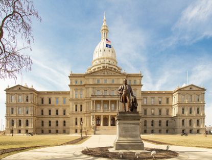 View of Michigan capitol building with blue sky in background