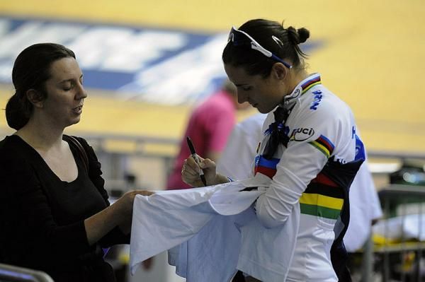 World sprint champion Victoria Pendleton signs an autograph.