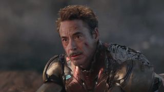 A screenshot of Robert Downey Jr. as Iron Man at the end of Avengers: Endgame right before he defeats Thanos.