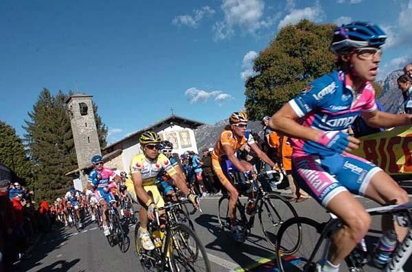 Look, no hands, ma. Cunego rides over the top with hands barred.