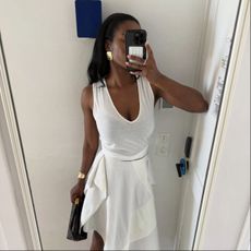 Marilyn in a white v-neck tank