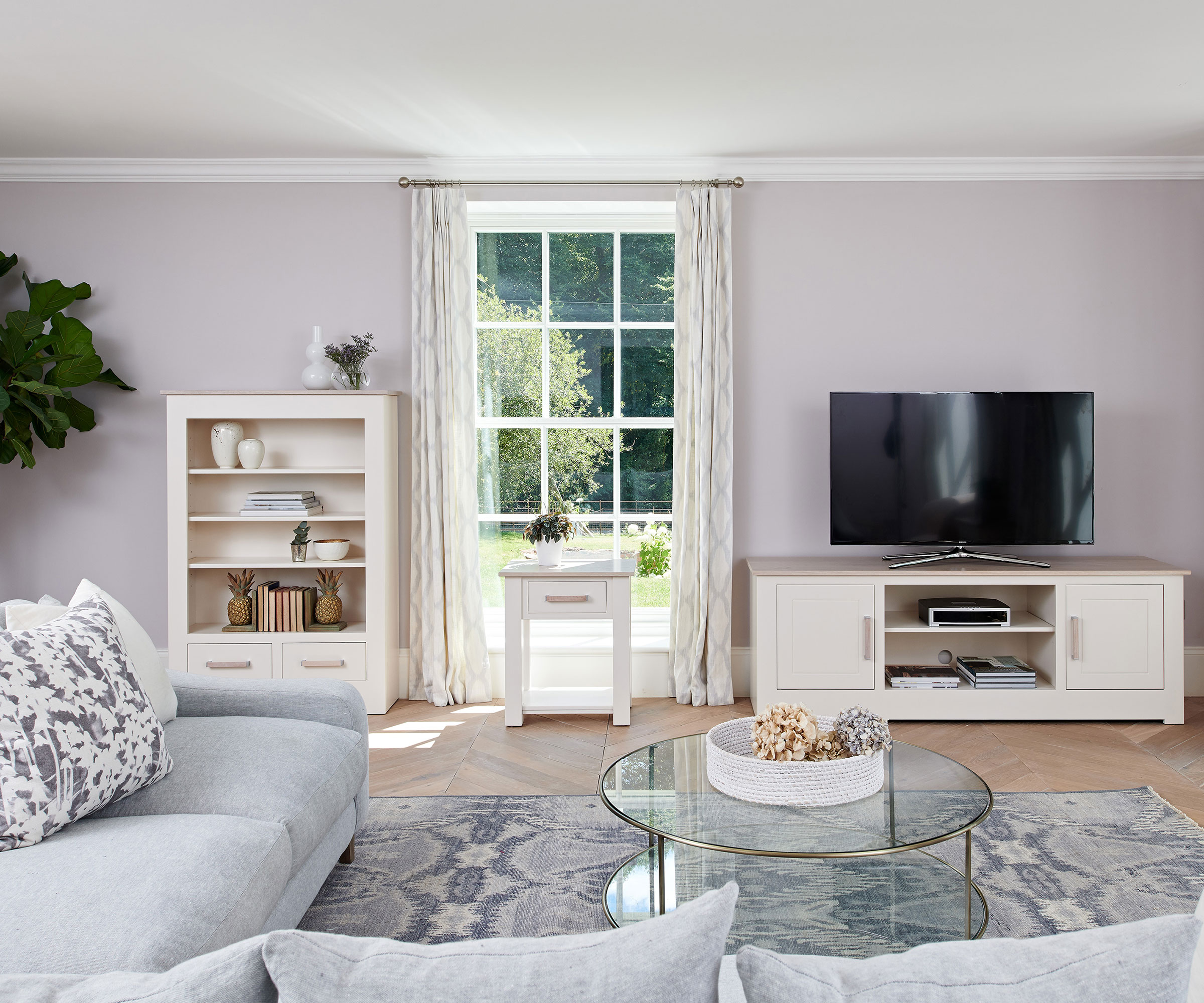 pale neutral living room with grey sofa and pale walls