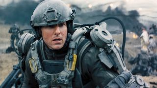 Tom Cruise in armor looking concerned at something in Edge of Tomorrow