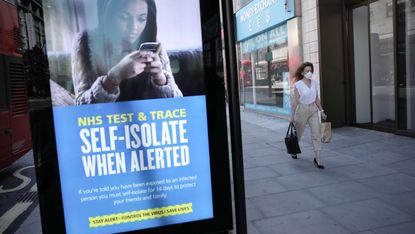 A sign warning people to self-isolate if contacted by NHS Test and Trace