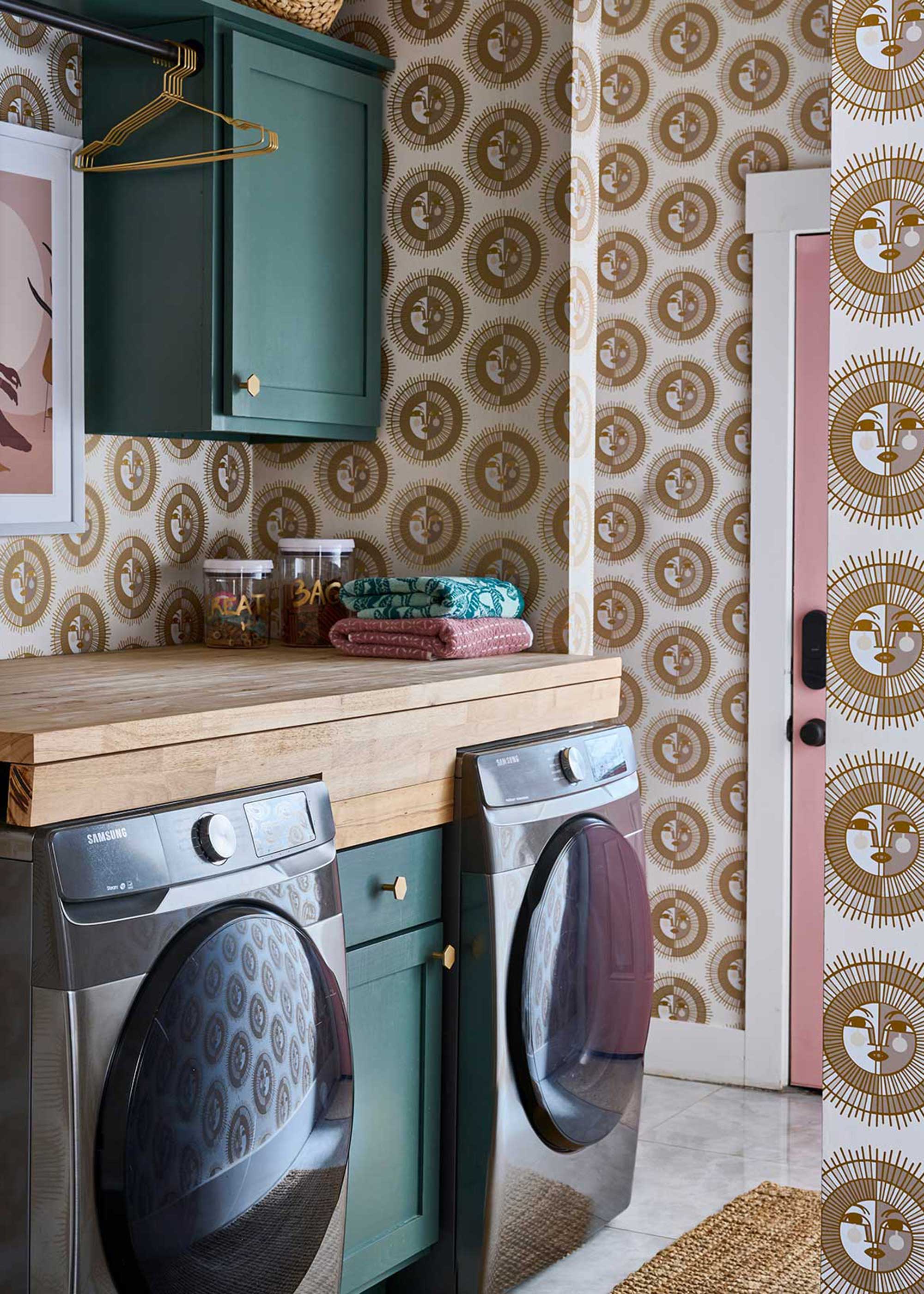 laundry room with gold and white sun pattern wallpaper