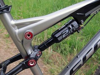 The new DT Swiss Nude 2 rear shock and forged one-piece aluminum link yield a much cleaner look than in years past
