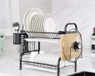 TOMORAL Dish Rack in white kitchen next to sink, filled with plates, cutlery, bowls, mugs and more