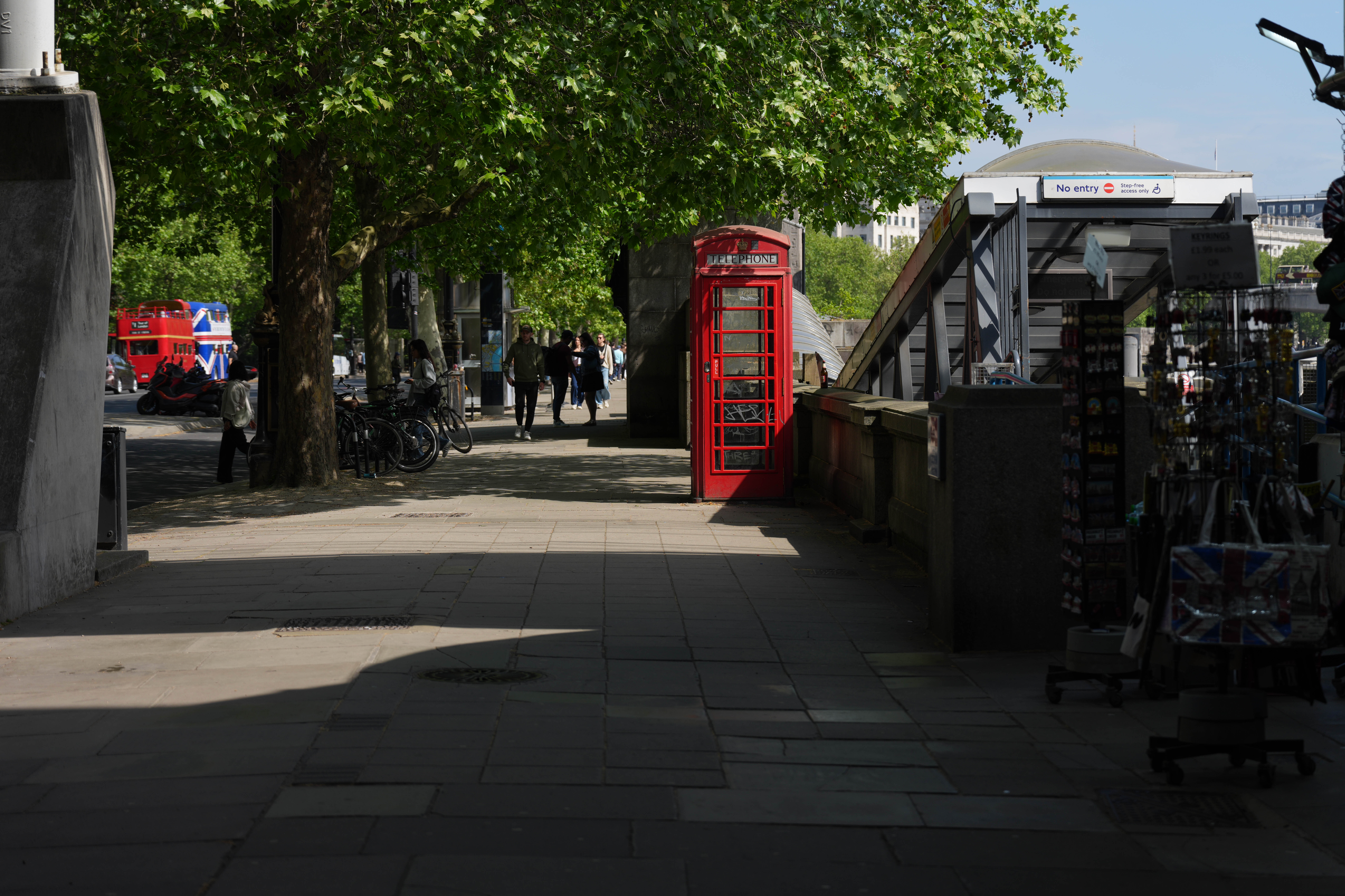Red telephone box near Westminster Bridge and a no-entry station entrance.