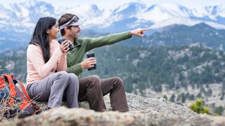 Two hikers using Nikon Prostaff binoculars