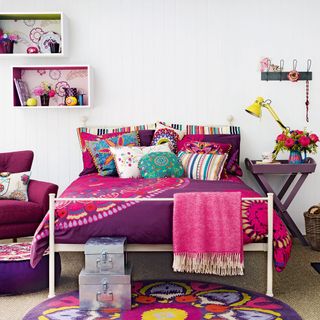 bedroom with purple side table