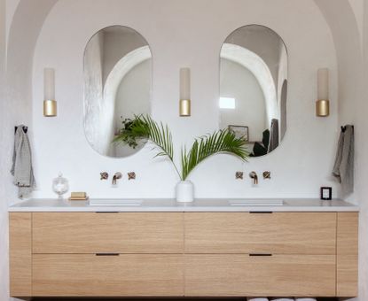 A bathroom in white, with IKEA vanity 