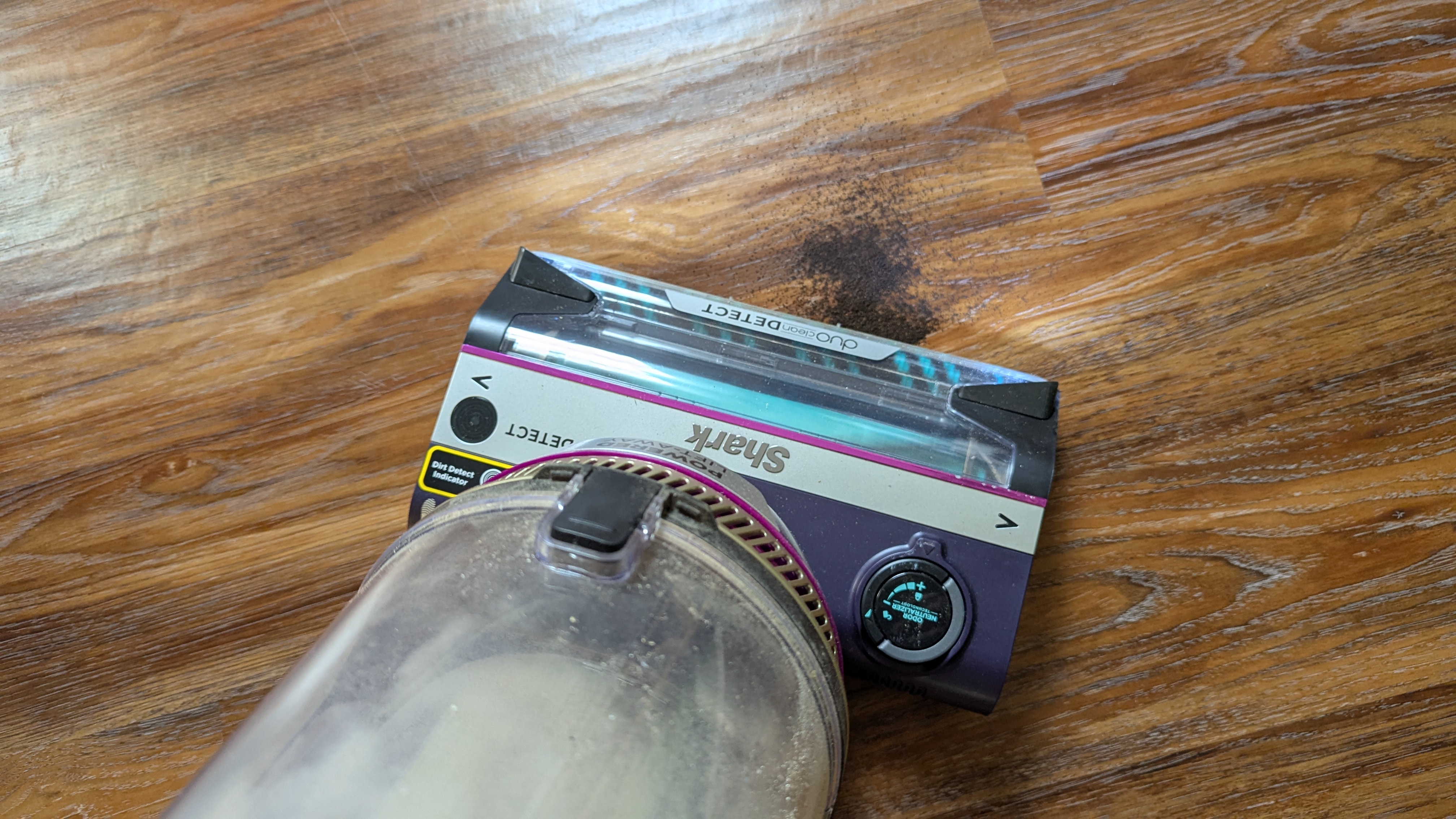 Shark PowerDetect Upright vacuum performing suction tests on hard floor