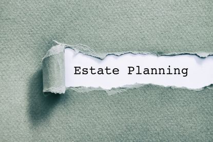 Estate planning written under torn paper on a light green background
