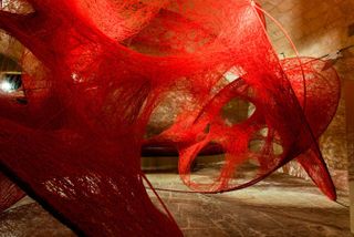 An installation of metal rings and red wool at the 16th-century Fort St Elmo in Valletta, Malta.