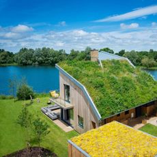 habitat house near river side with garden roof top