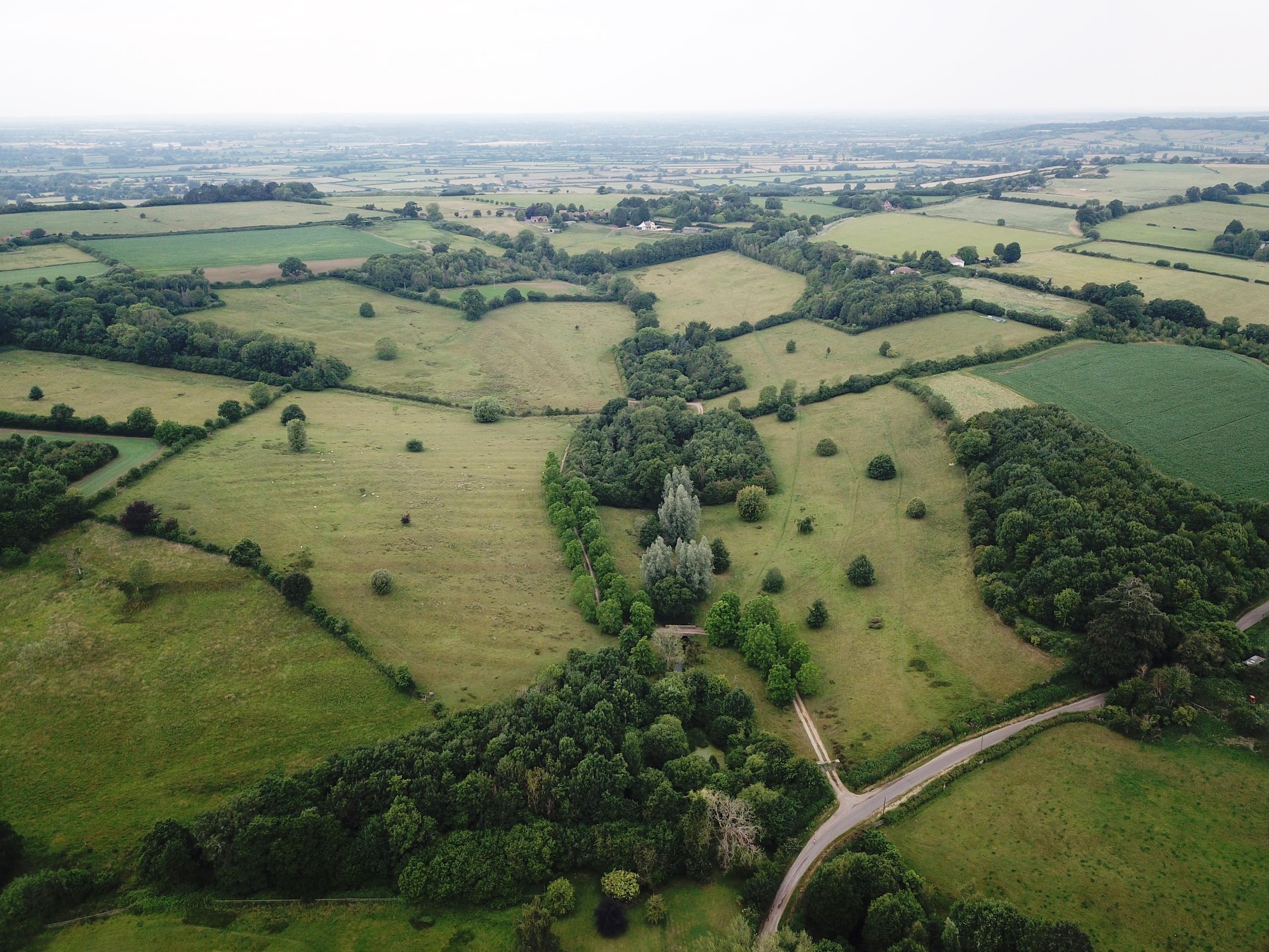 Mount Farm's surrounding area pictured from above, a sea of green fields