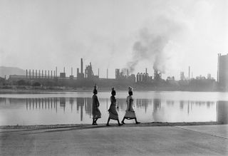 Employees of the Tata Iron and Steel Company on their way to work, Jamshedpur, India, May, 1951, by Werner Bischof.