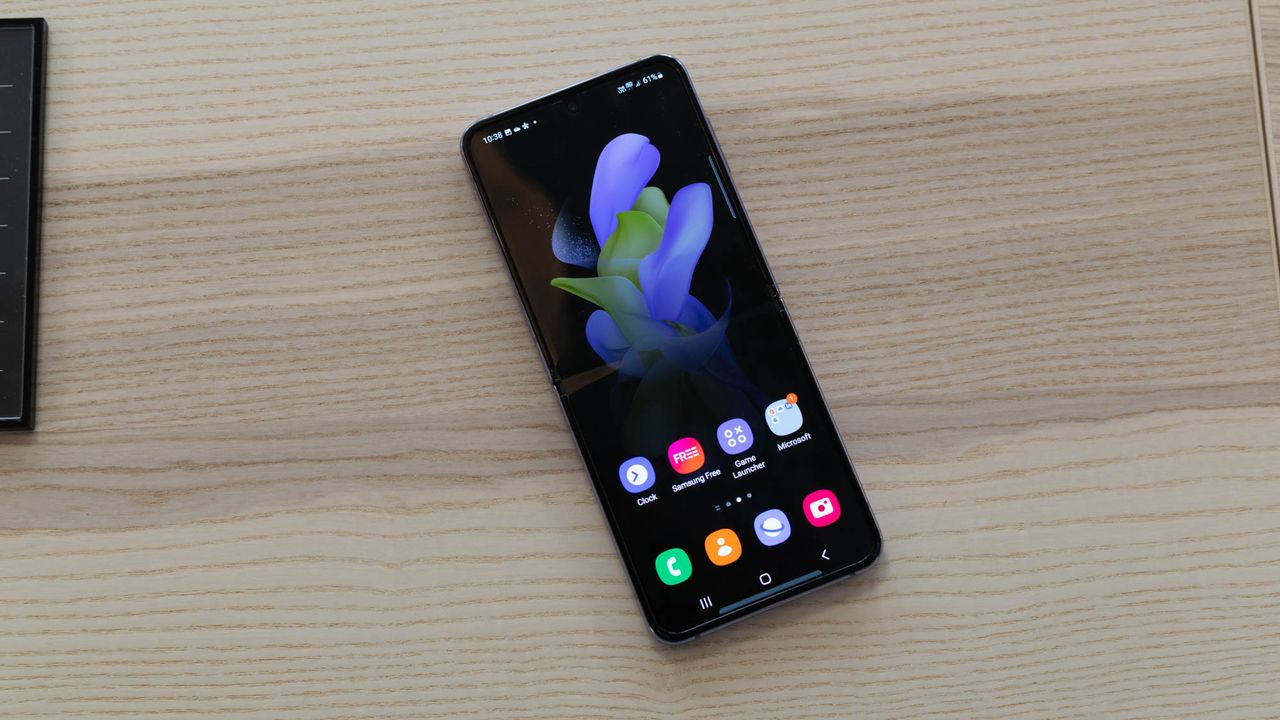 A photograph of the Samsung Galaxy Z Flip 4 unfolded on a table