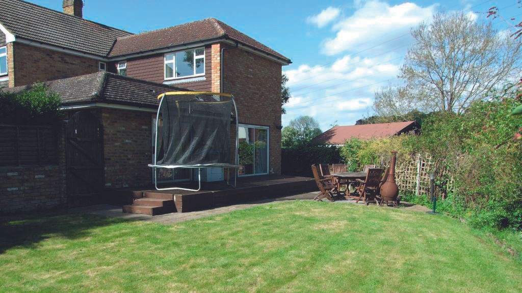 BEFORE: The poor layout of the original home included a series of small rooms and, even worse, a centrally placed garage that divided the ground floor.