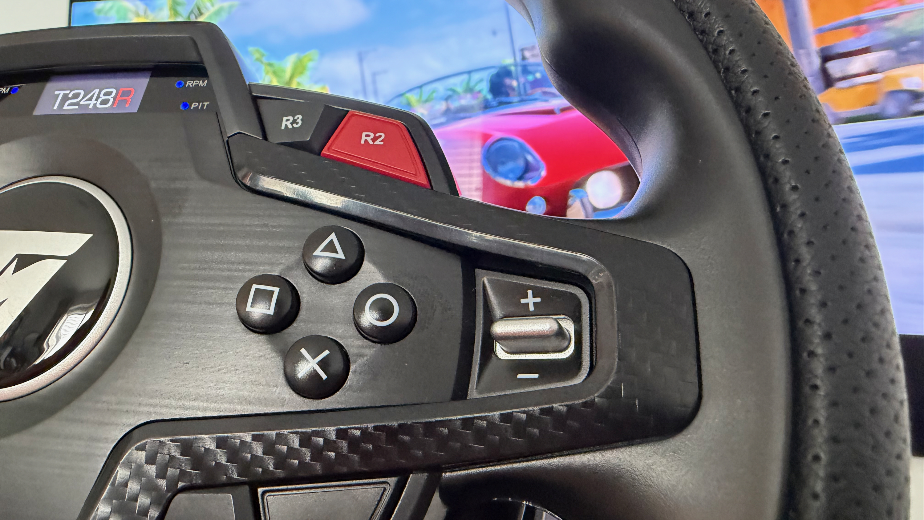 The PlayStation buttons on the right side of the Thrustmaster T248R
