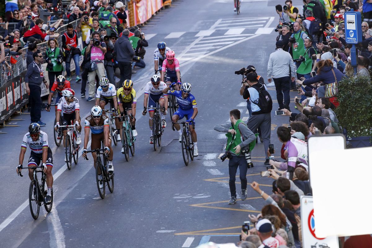 Julian Alaphilippe celebrates after the line