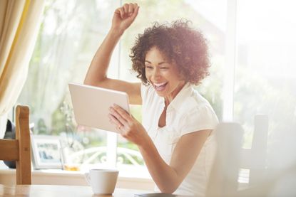 Woman celebrating after winning online bingo