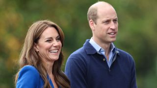 Catherine, Princess of Wales and Prince William, Prince of Wales smile as they arrive for their visit to SportsAid at Bisham Abbey National Sports Centre in 2023