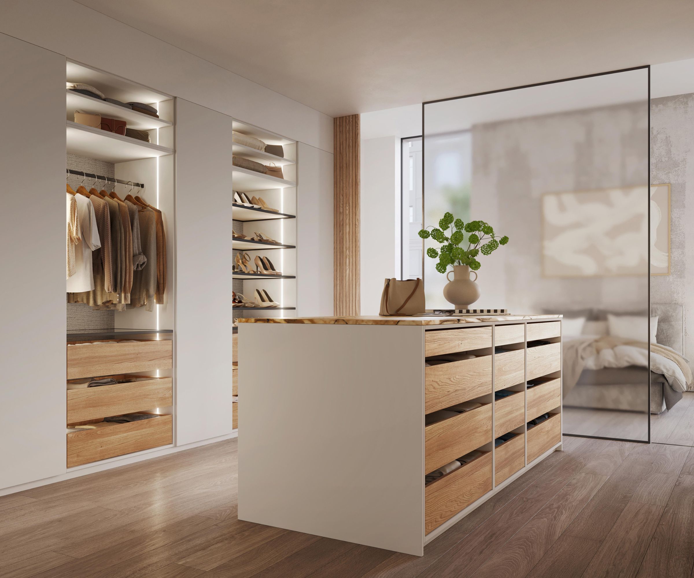 A sleek, contemporary walk-in wardrobe with built-in illuminated shelving. The shelving units feature vertical LED strip lighting, highlighting neatly arranged clothing and shoes. A large central island with wooden drawers and a white countertop provides additional storage.
