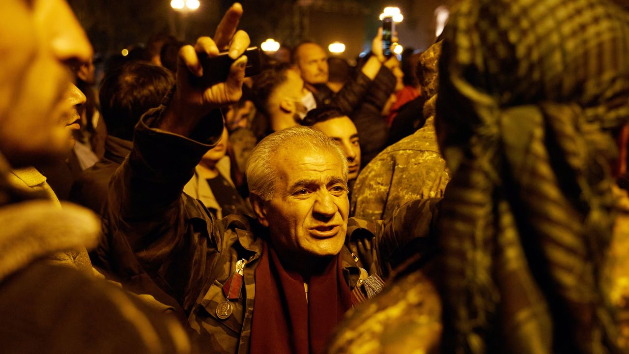 A veteran demonstrates after the announcement of a Russia-brokered peace deal in the war between Armenia and Azerbaijan
