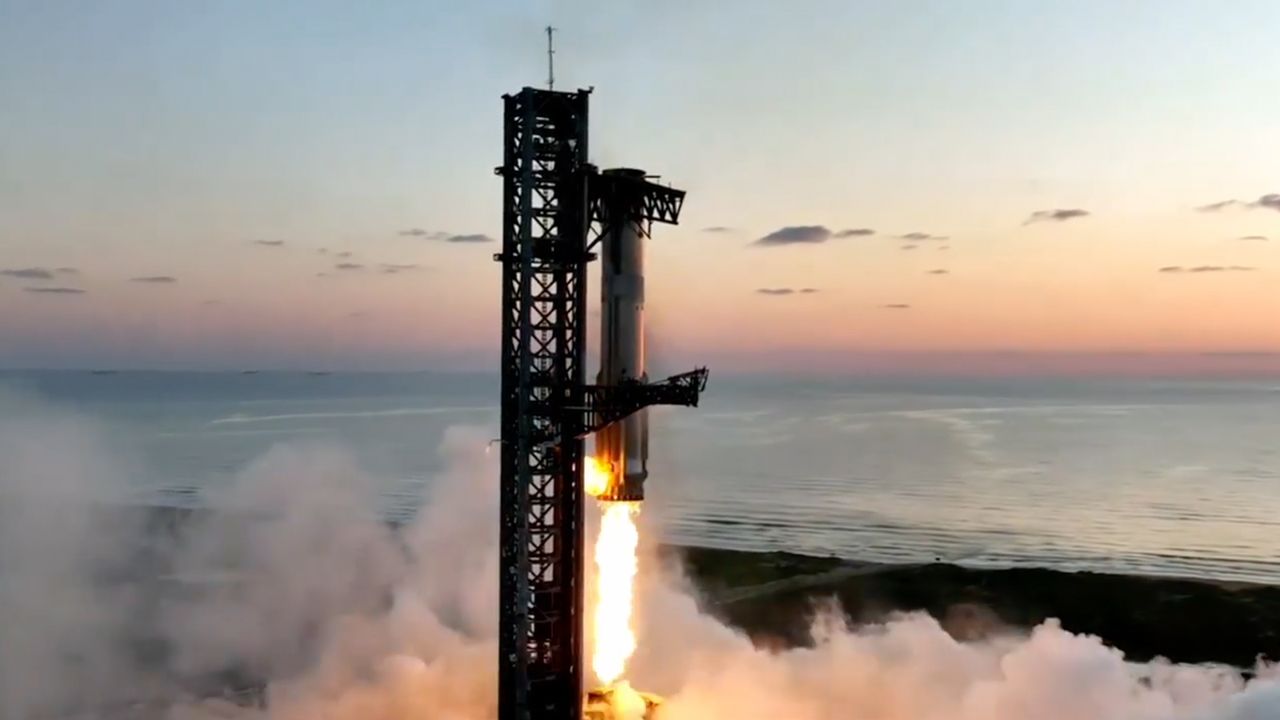 SpaceX's Starship Flight 5 Super Heavy booster approaches its launch tower for the first-ever landing and capture at the pad after launching on a suborbital test flight from Starbase in South Texas on Oct. 13, 2024.