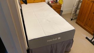 The Nectar Essential Hybrid Mattress on a bed