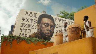 A mural of T'Challa as part of his funeral procession in the Black Panther: Wakanda Forever trailer