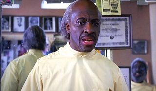 Eddie Murphy as the barber in Coming To America