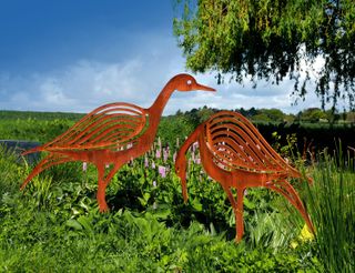 lawn decoration ideas: corten steel sculpture of birds