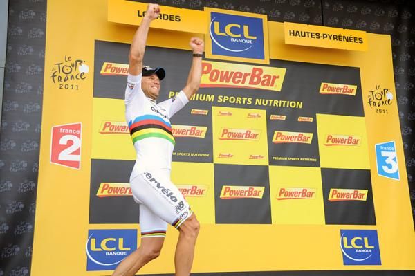 Stage 13 winner Thor Hushovd (Garmin-Cervelo) bounds onto the podium.
