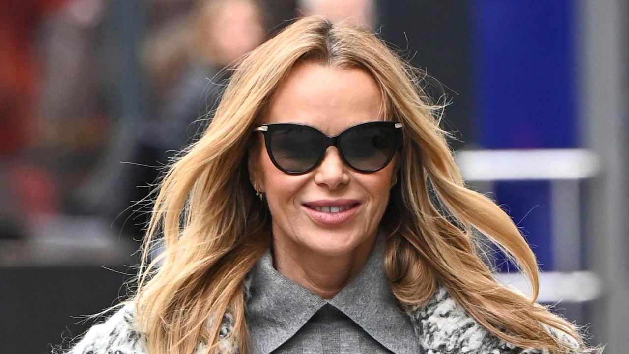 Amanda Holden wearing all grey outfit with oversized tailored coat